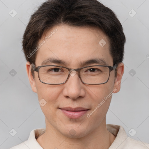 Joyful white adult male with short  brown hair and brown eyes