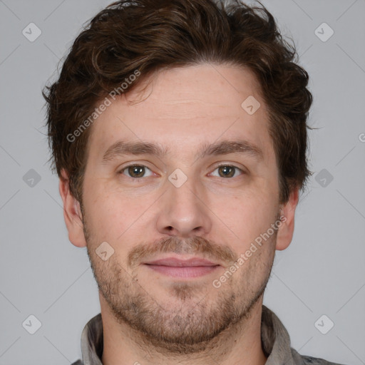 Joyful white adult male with short  brown hair and grey eyes