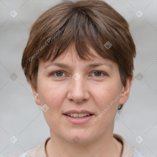 Joyful white adult female with short  brown hair and grey eyes