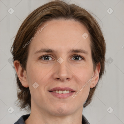 Joyful white adult female with medium  brown hair and grey eyes