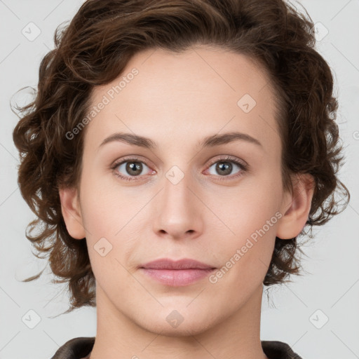 Joyful white young-adult female with medium  brown hair and green eyes