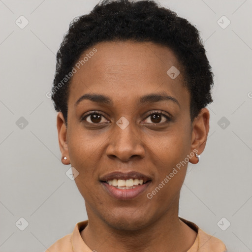 Joyful black young-adult female with short  black hair and brown eyes