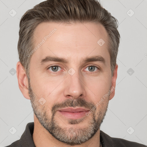 Joyful white adult male with short  brown hair and grey eyes