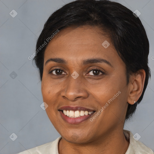 Joyful black young-adult female with medium  black hair and brown eyes