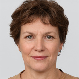 Joyful white adult female with short  brown hair and grey eyes