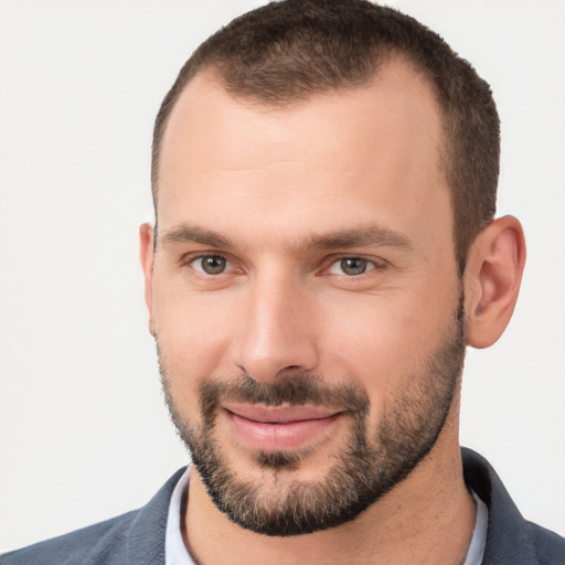 Joyful white young-adult male with short  brown hair and brown eyes