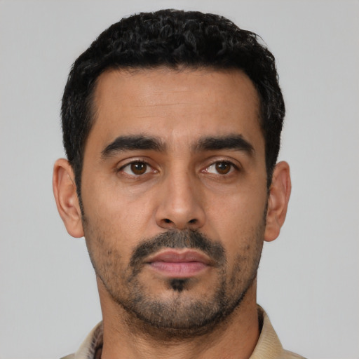 Neutral latino young-adult male with short  black hair and brown eyes