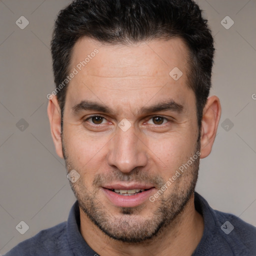 Joyful white adult male with short  brown hair and brown eyes