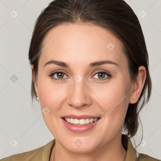 Joyful white young-adult female with medium  brown hair and grey eyes