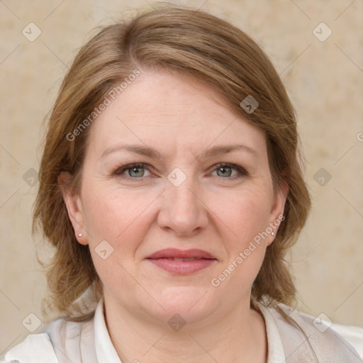 Joyful white adult female with medium  brown hair and grey eyes