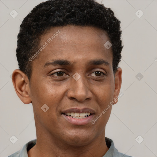 Joyful black young-adult male with short  brown hair and brown eyes