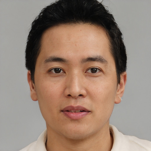 Neutral white young-adult male with short  black hair and brown eyes