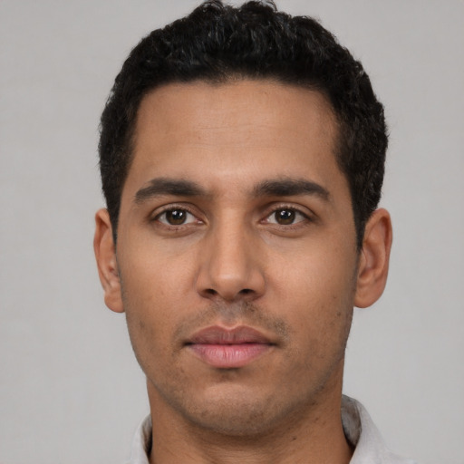 Neutral latino young-adult male with short  black hair and brown eyes