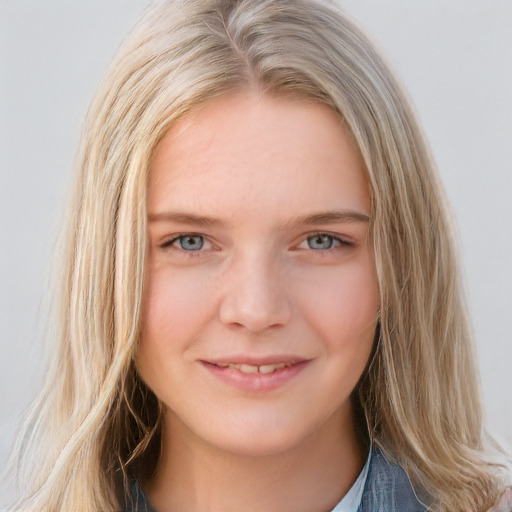 Joyful white young-adult female with long  blond hair and blue eyes