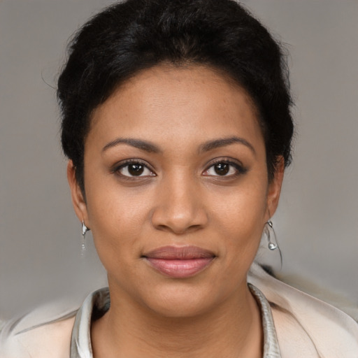 Joyful latino young-adult female with short  brown hair and brown eyes