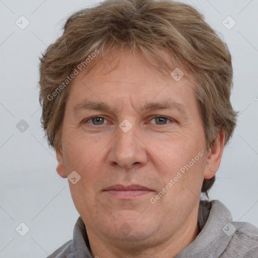 Joyful white adult male with short  brown hair and grey eyes