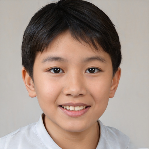 Joyful white child female with short  brown hair and brown eyes