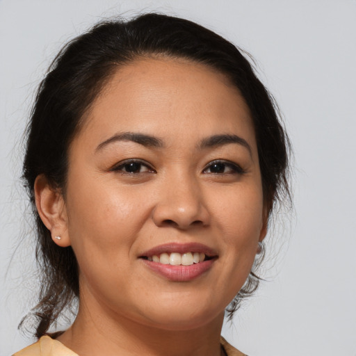 Joyful white young-adult female with medium  brown hair and brown eyes