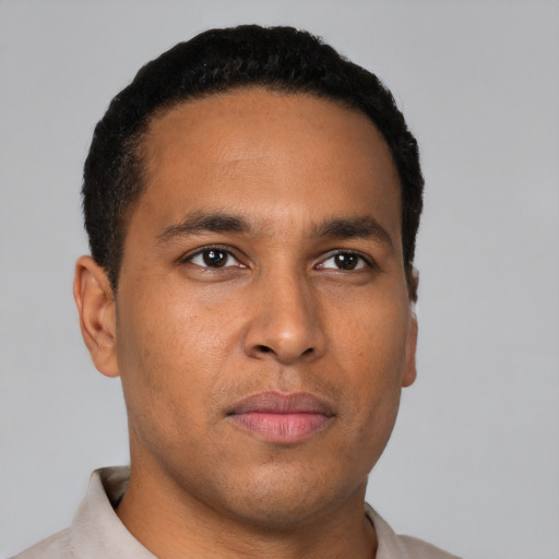 Neutral latino young-adult male with short  black hair and brown eyes