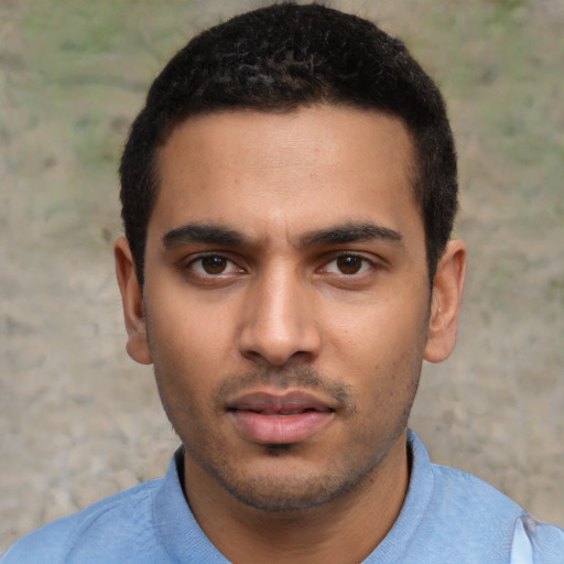 Neutral latino young-adult male with short  brown hair and brown eyes