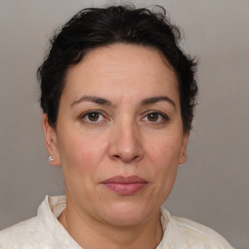 Joyful white adult female with short  brown hair and brown eyes