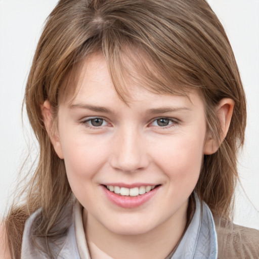 Joyful white child female with medium  brown hair and brown eyes