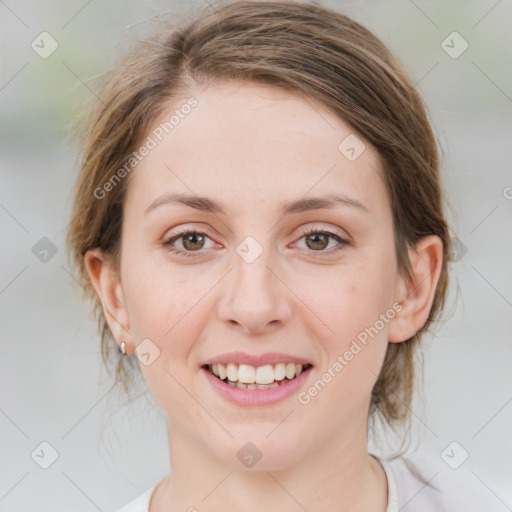 Joyful white young-adult female with medium  brown hair and green eyes