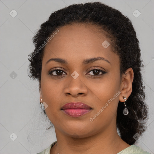 Joyful black young-adult female with medium  brown hair and brown eyes