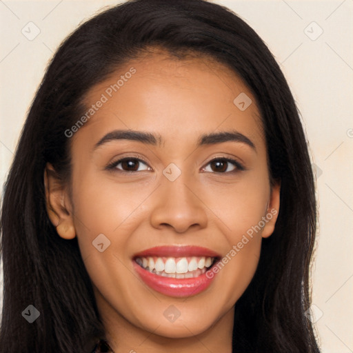 Joyful latino young-adult female with long  brown hair and brown eyes