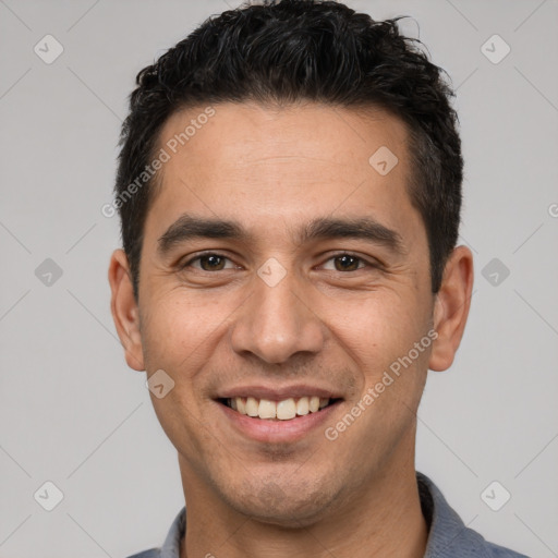 Joyful white young-adult male with short  black hair and brown eyes