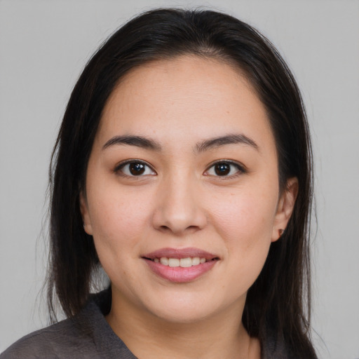 Joyful asian young-adult female with medium  brown hair and brown eyes