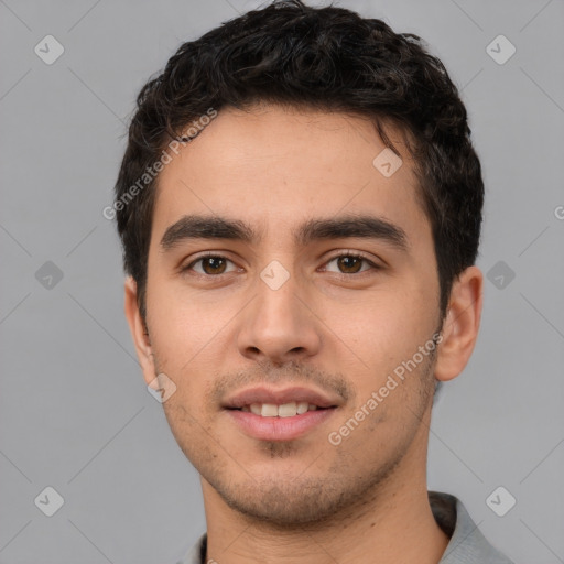 Joyful white young-adult male with short  black hair and brown eyes