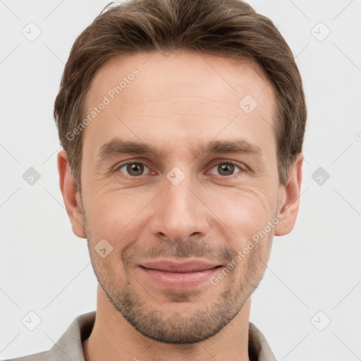 Joyful white adult male with short  brown hair and grey eyes