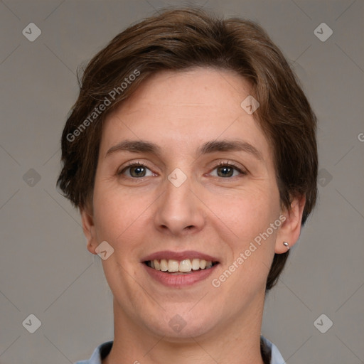 Joyful white adult female with short  brown hair and grey eyes