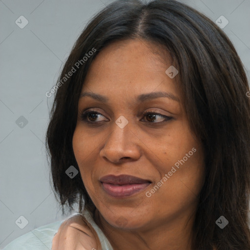 Joyful white adult female with long  brown hair and brown eyes