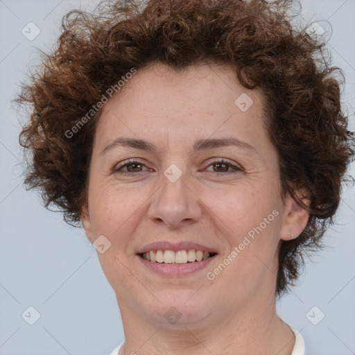 Joyful white adult female with short  brown hair and brown eyes