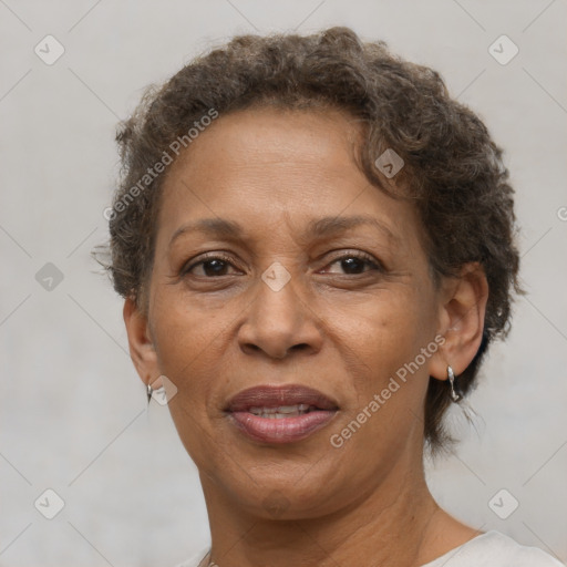 Joyful black adult female with short  brown hair and brown eyes