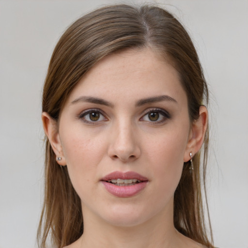 Joyful white young-adult female with long  brown hair and grey eyes