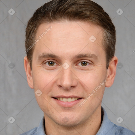 Joyful white adult male with short  brown hair and grey eyes