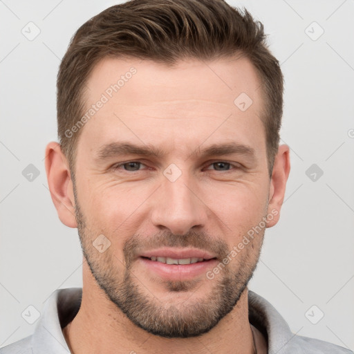 Joyful white adult male with short  brown hair and brown eyes