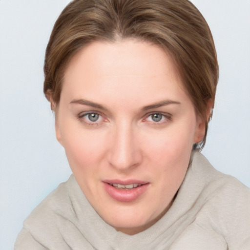 Joyful white young-adult female with medium  brown hair and blue eyes