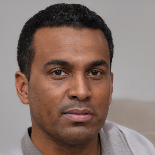 Neutral black young-adult male with short  brown hair and brown eyes