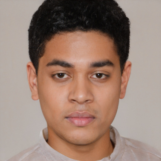 Neutral latino young-adult male with short  black hair and brown eyes