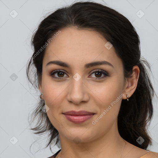 Joyful latino young-adult female with medium  brown hair and brown eyes