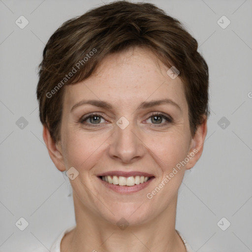 Joyful white young-adult female with short  brown hair and grey eyes