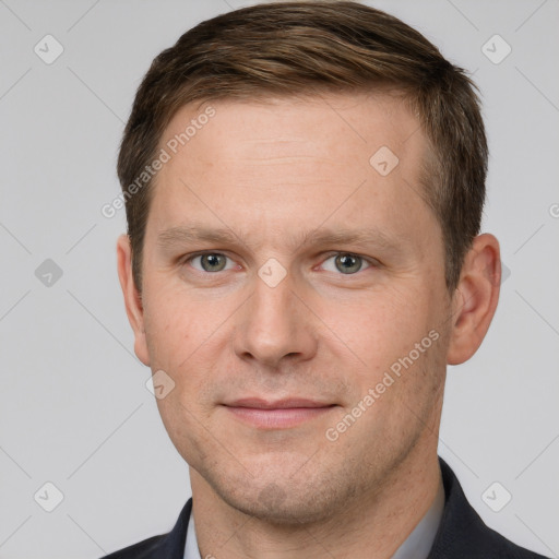 Joyful white adult male with short  brown hair and brown eyes