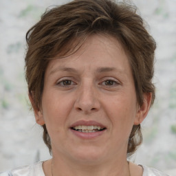 Joyful white adult female with short  brown hair and brown eyes