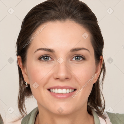 Joyful white young-adult female with medium  brown hair and green eyes