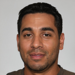 Neutral white young-adult male with short  black hair and brown eyes