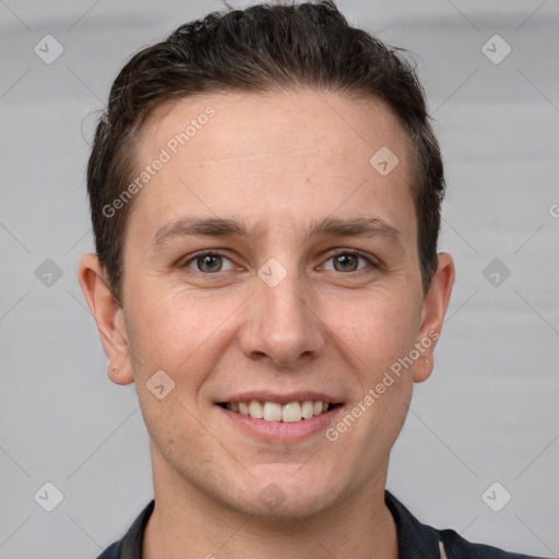 Joyful white adult male with short  brown hair and grey eyes